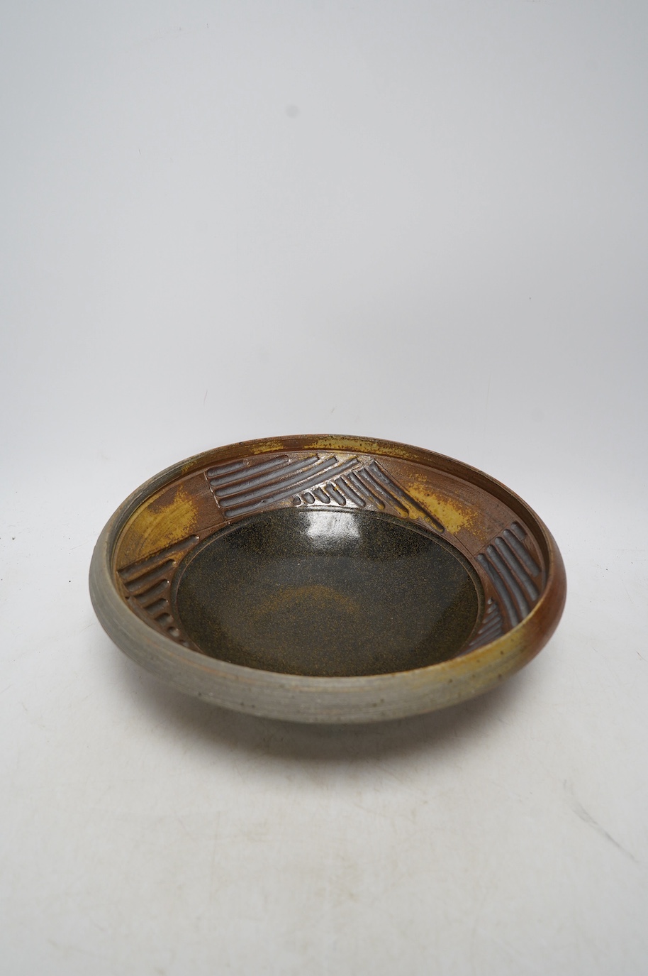 Thiebaut Chagué (b.1958), a studio pottery stoneware bowl, stamped to the foot rim, 27cm diameter. Condition - good